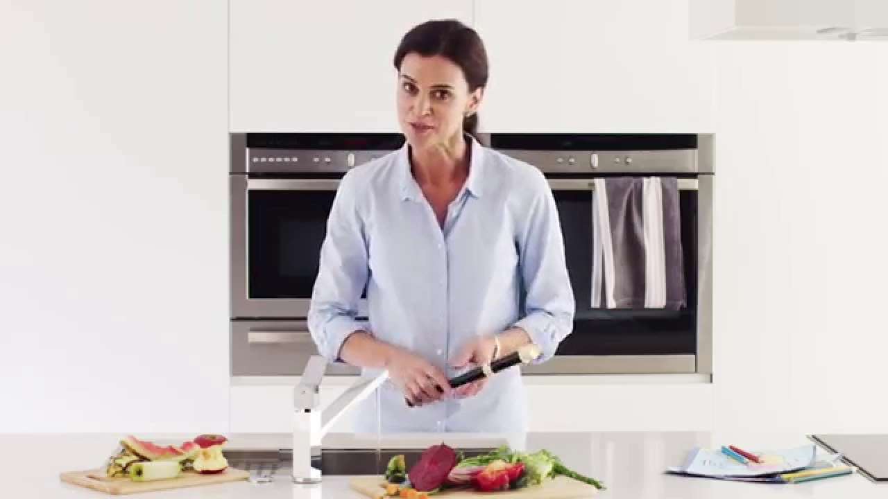 How does a food waste disposer work?